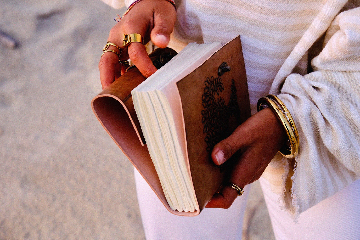 Open COFFT leather notebook showing thick white pages, brown cover and handcrafted everyday stationery design