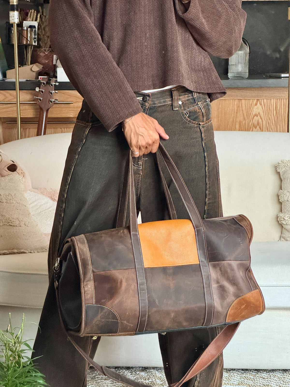 Brown leather travel duffle bag by COFFT with contrasting leather panels