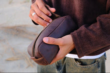 Open COFFT Espresso leather pouch close-up with zipper detail, structured shape and smooth leather texture