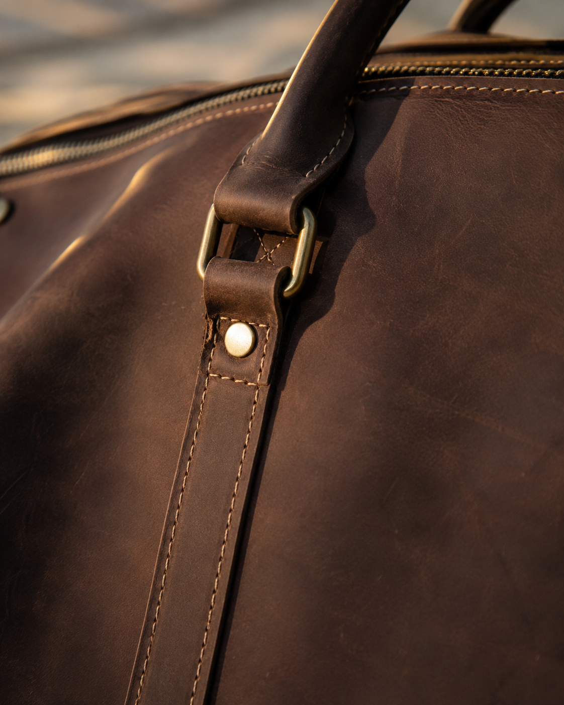 COFFT Crazy Horse leather bag in natural sunlight showing rich tone variation and authentic waxed finish